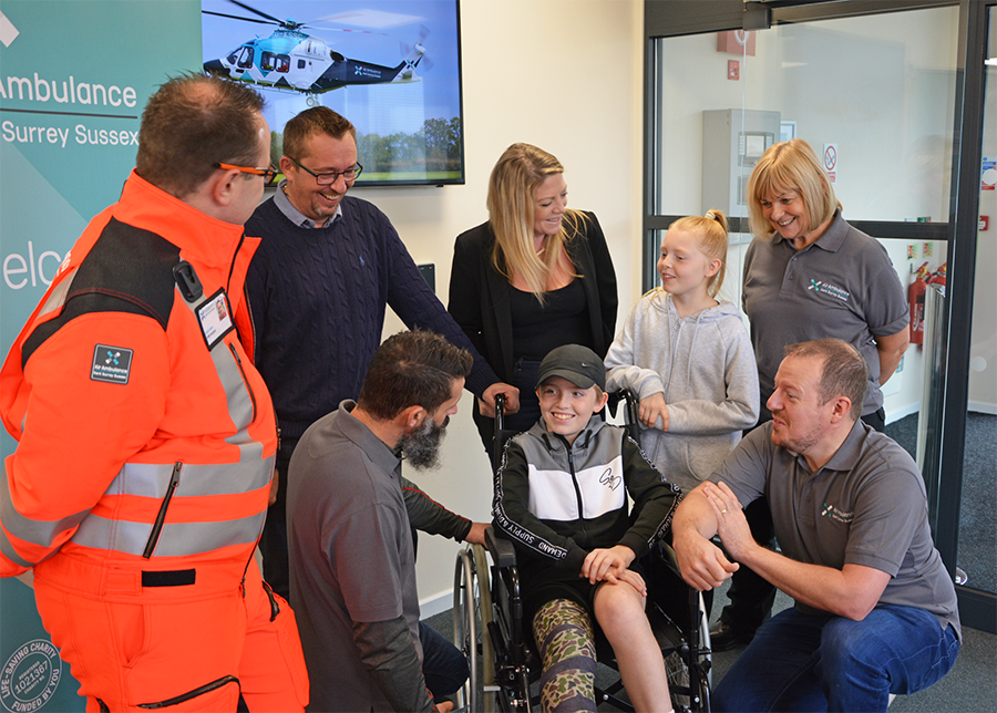 Pictured with Billy are (l to r): paramedic Lewis Allam, paramedic Al Crawford, father Michael McLean, mother Karina Radley, sister Elsie McLean, paramedic Dave Hawkins and dispatcher Carol Lewis